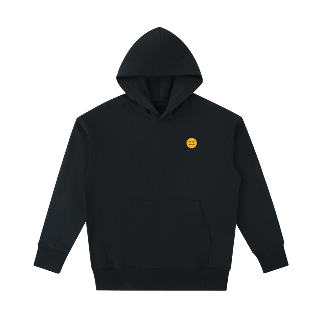 A black pullover hoodie with a small yellow embroidered smiley face on the left chest, displayed against a solid white background.